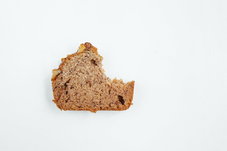 Best Gluten Free Dairy Free Banana Bread Recipes a Single Slice of Banana Bread with a Bite Taken from the Corner