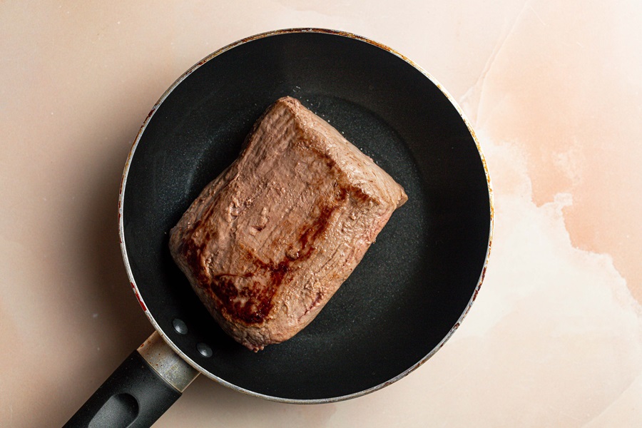 Old Fashioned Pot Roast Recipe in the Slow Cooker a Pot Roast Searing in a Pan