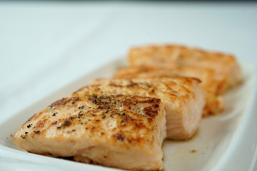 Paleo vs Keto Close Up of Three Cuts of Salmon Fully Cooked