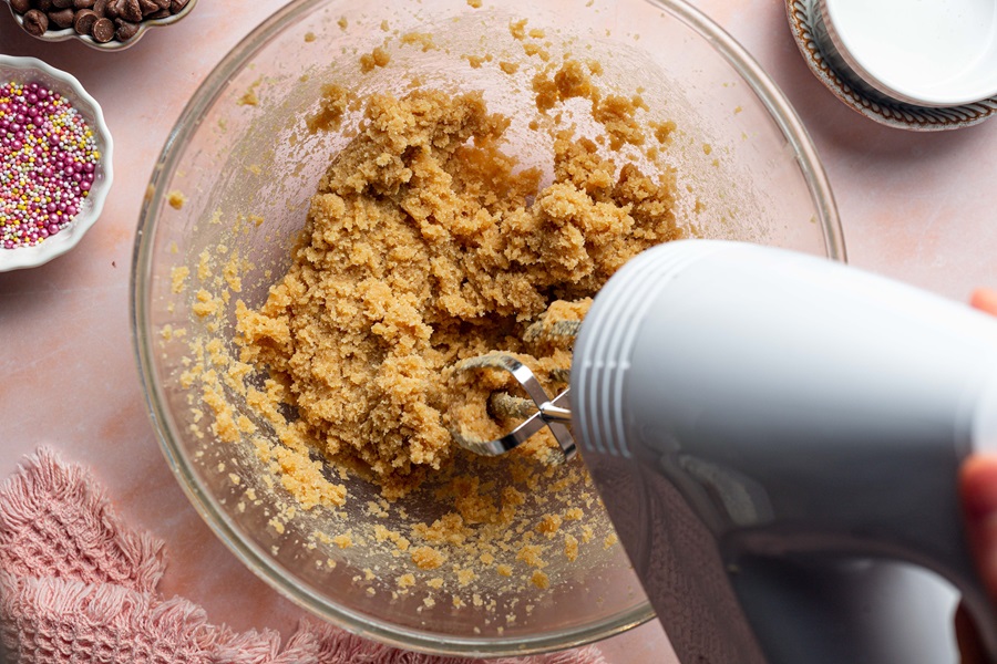 Egg Free Sugar Cookie Recipe a Hand Mixer Mixing Cookie Dough in a Bowl