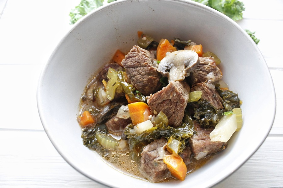 Quick and Easy Low Carb Beef Stew Recipe Close Up of a Bowl of Beef Stew with Kale, Mushrooms, and Carrots