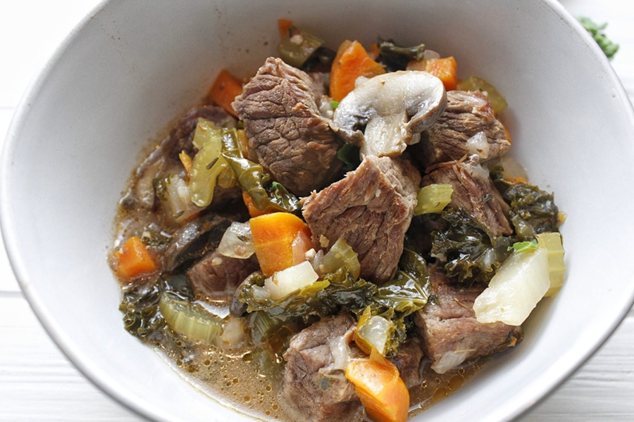 Slow Cooker Low Carb Beef Stew Recipe a Bowl of Beef Stew in Front of an Crock Pot