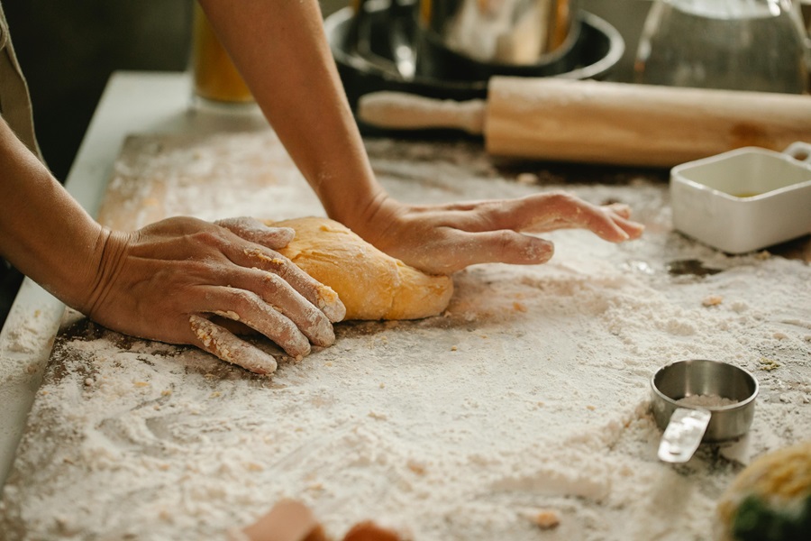 Is Gluten Free Bread Good for Diabetics Close Up of a Person Kneading Dough on a Floured Surface