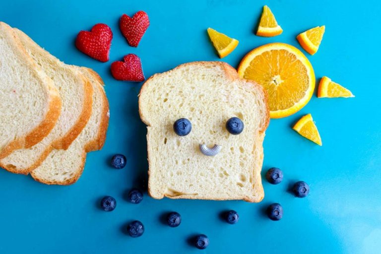 Is Gluten Free Bread Good for Diabetics a Slice of White Bread with Blueberries, Strawberries, and Oranges Around it