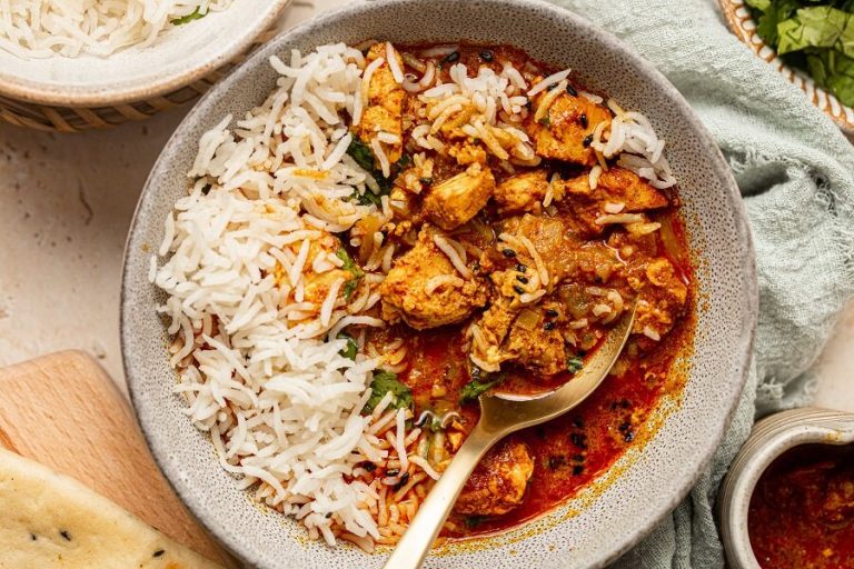 Healthy Summer Dinners a Bowl of Chicken Tikka Masala with Rice and a Spoon
