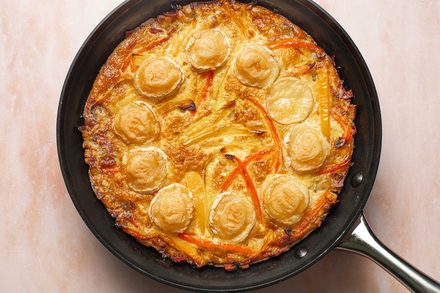 Healthy and Easy Breakfast Skillet Recipe with Potatoes Overhead View of a Skillet with Eggs, Potatoes, and Cheese Inside