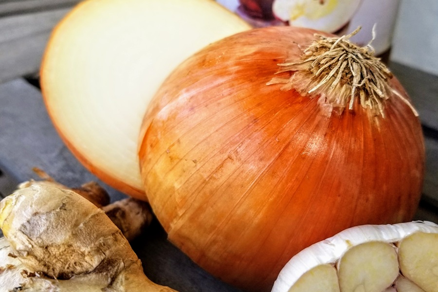 Healing Chicken Bone Broth Recipe Close Up of an Onion Cut in Half