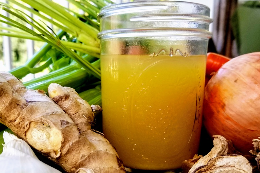 Healing Chicken Bone Broth Recipe Close Up of a Glass Jar Filled with Broth