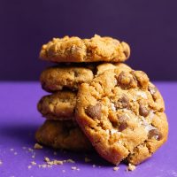 Air Fryer Peanut Butter Cookies without Flour a Small Stack of Cookies on a Purple Background