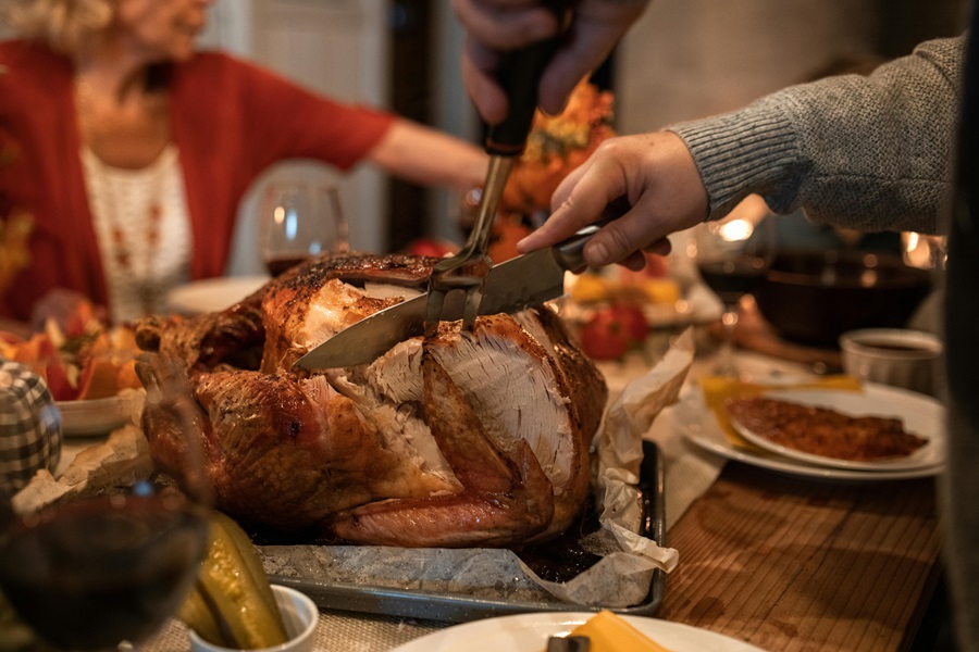 Healthy Leftover Turkey Recipes Close Up of a Turkey Being Carved on a Table