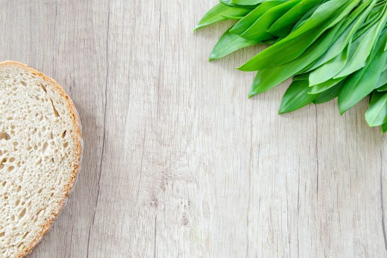 Is Sourdough Bread Good for Diabetics Close Up of a Slice of Bread on a Wooden Surface