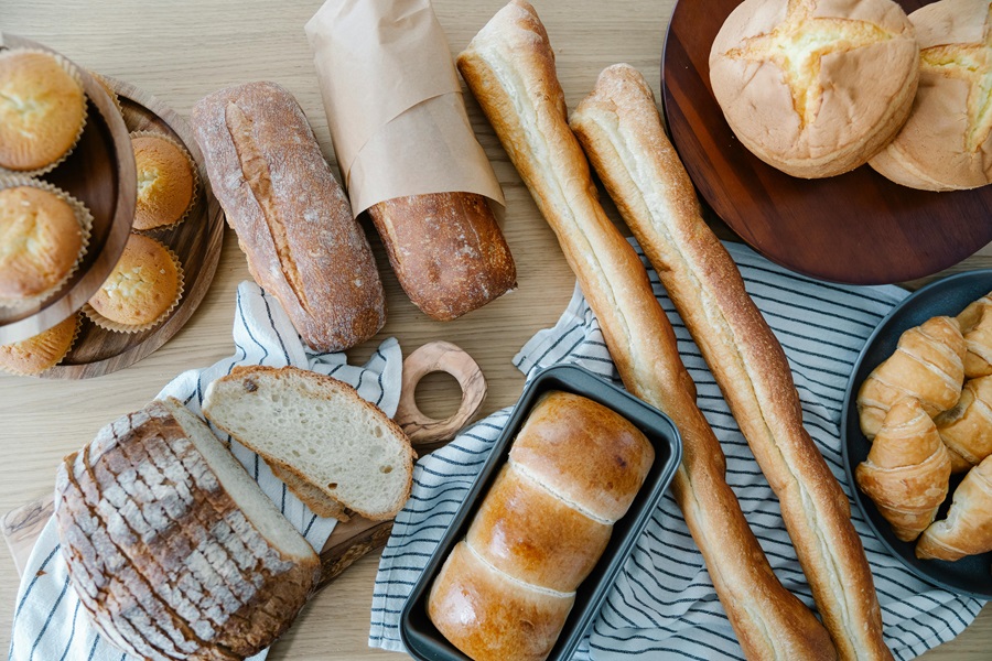 Is Sourdough Bread Good for Diabetics Overhead View of Loaves of Bread on a Wooden Counter Top