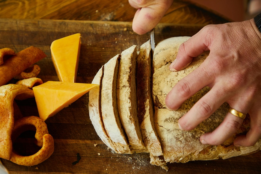 Is Sourdough Bread Good for Diabetics a Loaf of Bread on a Cutting Board with Cheddar Cheese