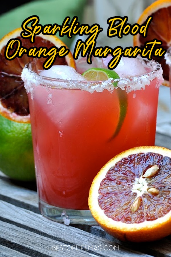 With freshly squeezed blood oranges and limes, this sparkling blood orange margarita adds a refreshing twist to a classic cocktail. Happy Hour Recipes | Cocktail Recipes | Margarita Recipes | Halloween Cocktail Recipes | Fall Cocktail Recipes via @amybarseghian