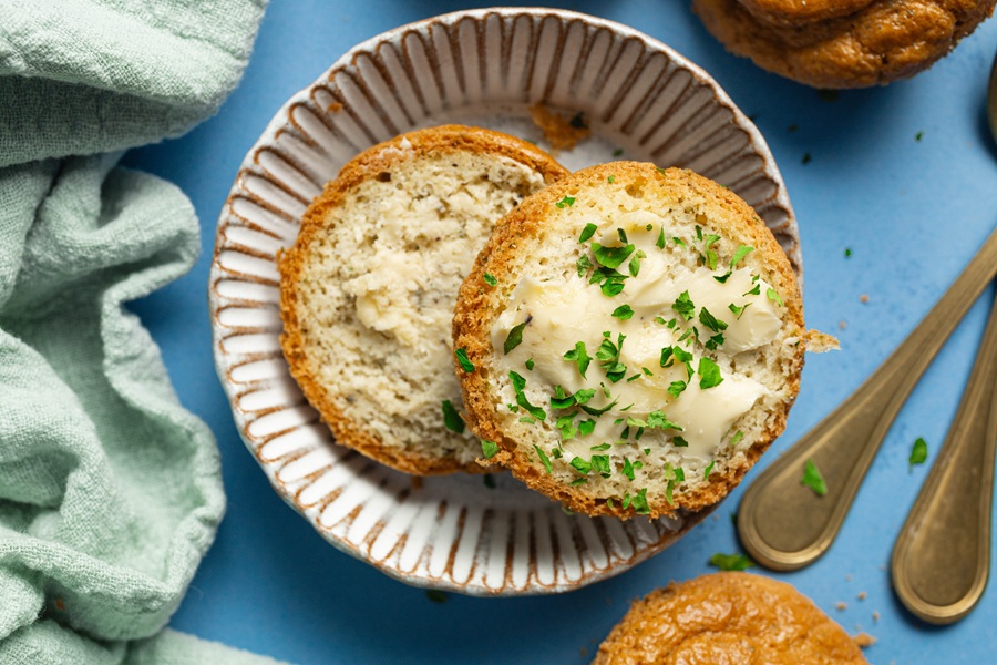 Easy Keto Almond Flour Bread Recipe an Almond Flour Bread Roll Cut in Half with Garlic Butter on One Side