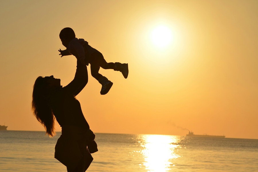 Healthy Mothers Day Breakfast Ideas a Silhouette of a Mom Lifting Her Baby Into the Air