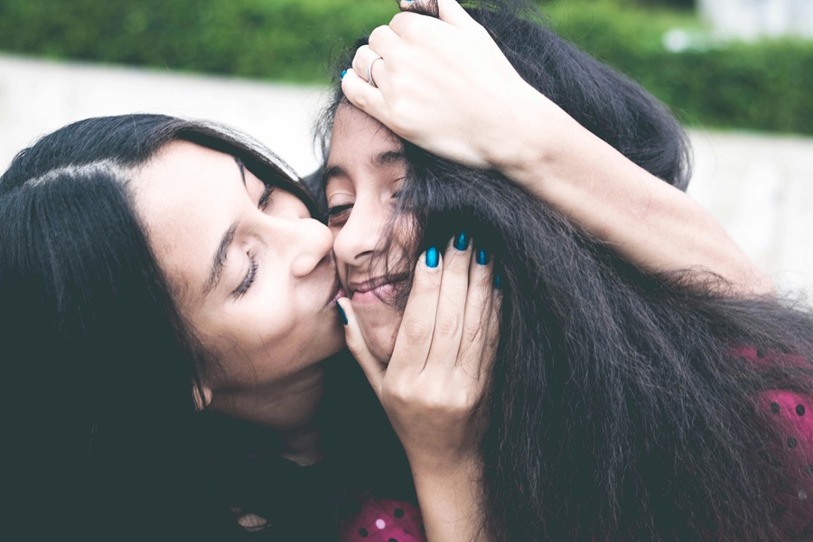 Healthy Mothers Day Breakfast Ideas a Mom Holding Her Daughter's Head and Giving Her a Kiss on Her Cheek