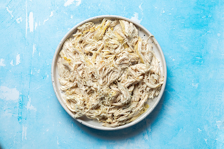 Easy Chicken Tacos with Shredded Chicken a Plate of Shredded Chicken
