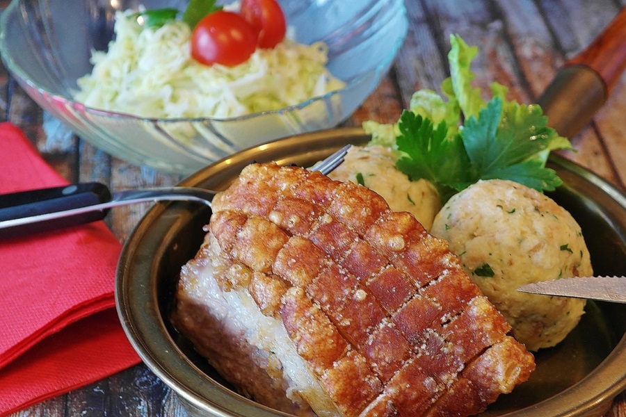 Can I Put a Frozen Pork Roast in the Crockpot Cooked Pork on a Plate with Potatoes and Parsley