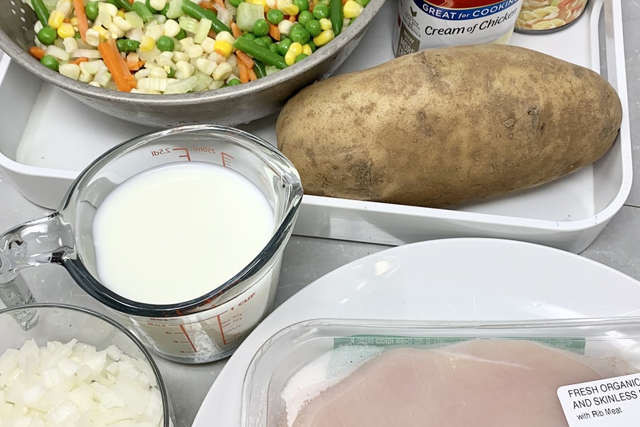 Chicken Pot Pie with Biscuits Ingredients Separated into Bowls and Measuring Cups