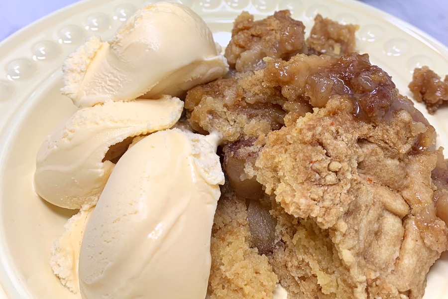 Crockpot Apple Crisp on a Plate with Ice Cream