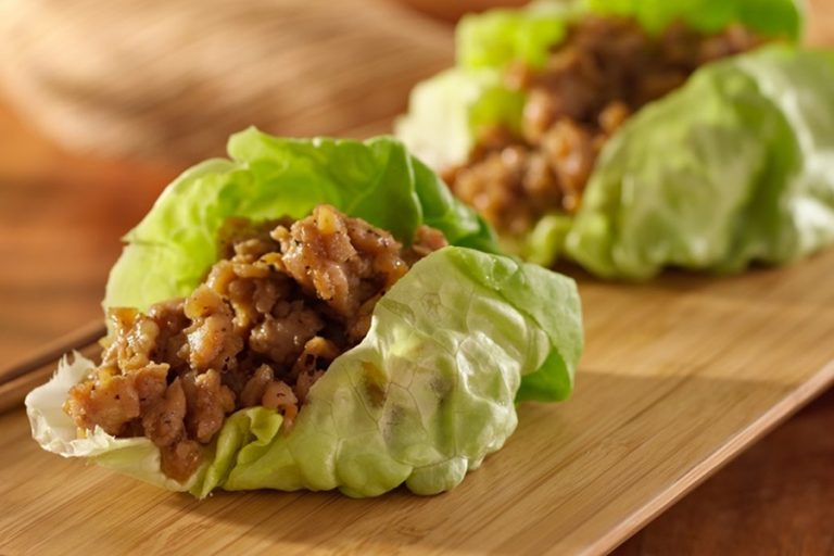 Crockpot Dinner Recipes with Ground Chicken Close Up of Chicken Lettuce Cups on a Wooden Plate