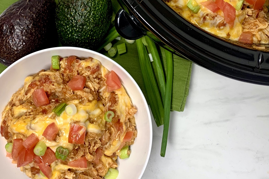 Easy Chicken Burrito Bowl Recipe Overhead View of a Burrito Bowl Next to a Crock Pot