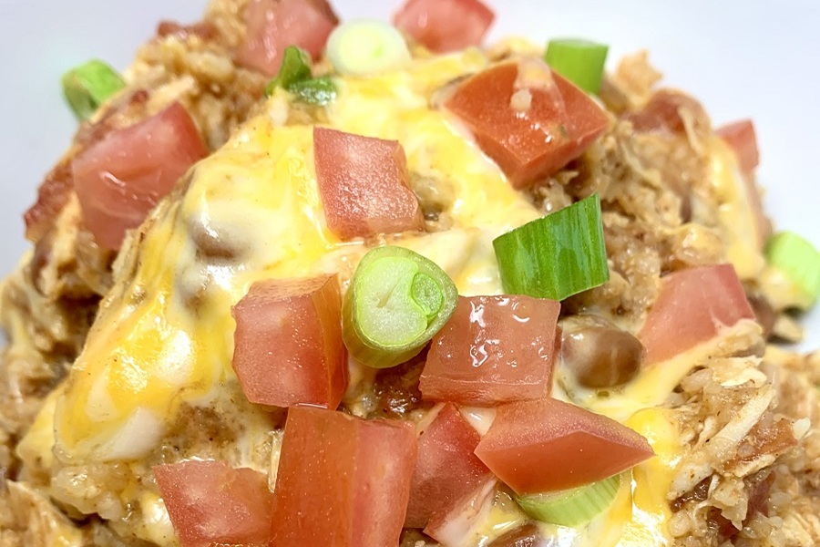 Easy Chicken Burrito Bowl Recipe Close Up of Diced Tomatoes, Cheese, and Green Onions
