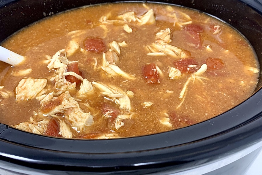Easy Chicken Burrito Bowl Recipe Ingredients Mixing Together Inside a Crock Pot