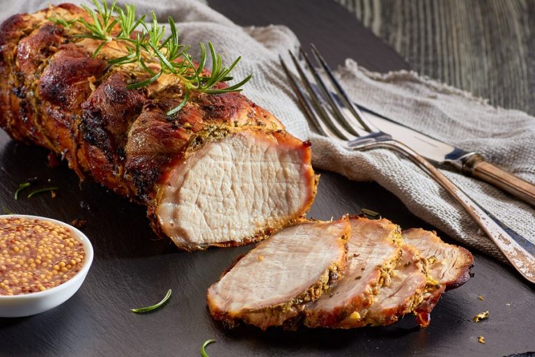Easy Pork Loin Recipes for the Slow Cooker a Cooked Pork Loin on a Cutting Board with a Few Slices Already Cut