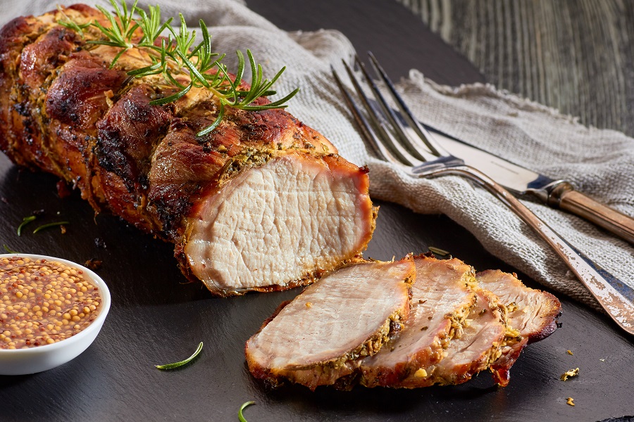 Easy Pork Loin Recipes for the Slow Cooker a Cooked Pork Loin on a Cutting Board with a Few Slices Already Cut