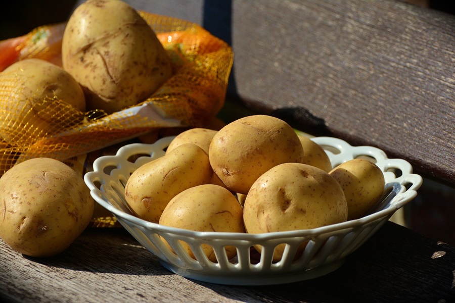 Baked Potatoes in the Oven Close Up of a Bowl of Potatoes
