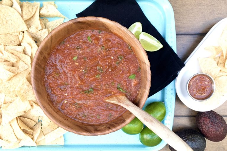 Homemade Salsa Recipe Overhead View of a Bowl of Salsa on a Platter with Tortilla Chips and Napkins