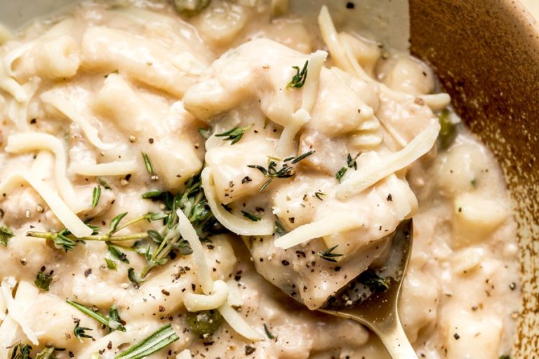Easy Leftover Turkey and Noodles Recipe Close Up of a Silver Spoon in a Bowl of Turkey Casserole