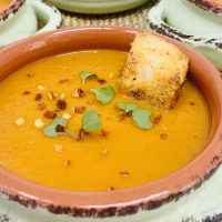 Easy Red Pepper Tomato Soup Close Up of Four Bowls of Soup