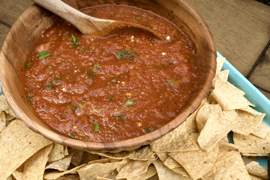 Homemade Salsa Recipe a Bowl of Salsa with a Wooden Spoon Inside 