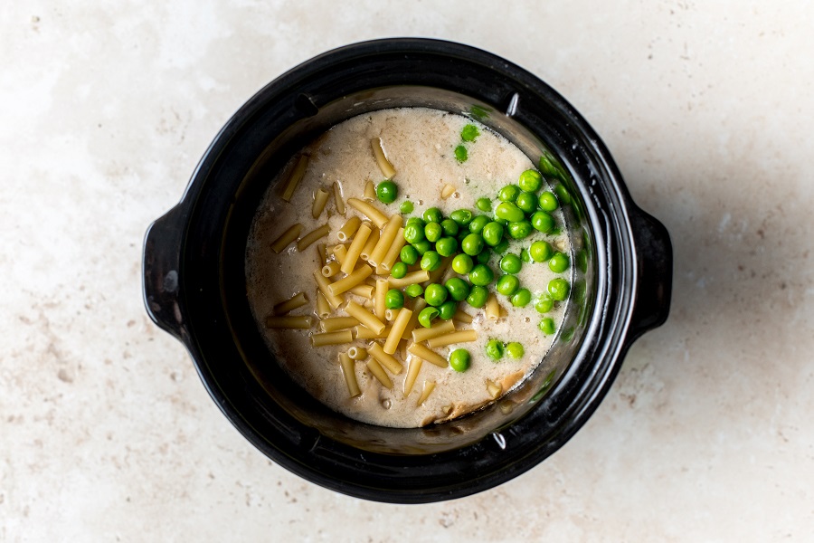 Easy Leftover Turkey and Noodles Recipe Overhead View of a Crockpot With Ingredients Cooking Inside