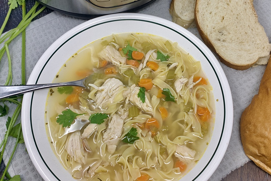 Quick Chicken Noodle Soup in a Bowl with a Spoon