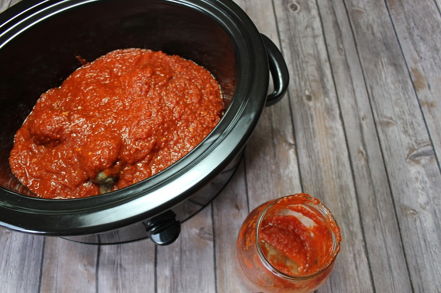 Crockpot Jokes Overhead View of a Crockpot with Meatballs and Sauce Inside