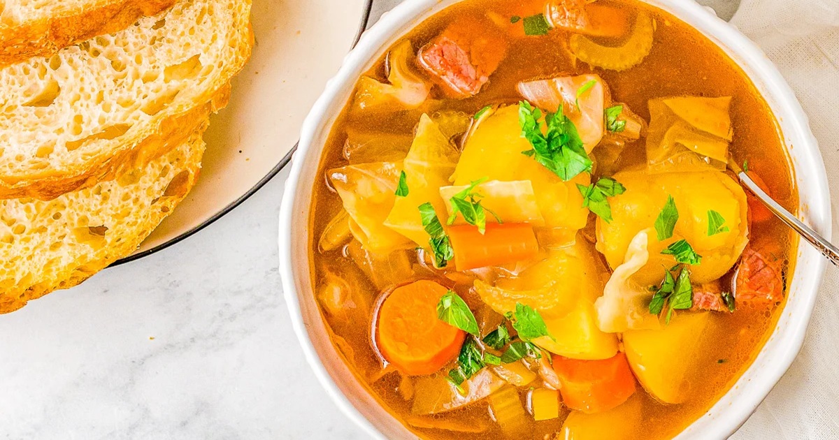 St Patrick's Day Crockpot Recipes Slow Cooker Corned Beef and Cabbage Soup in a White Bowl