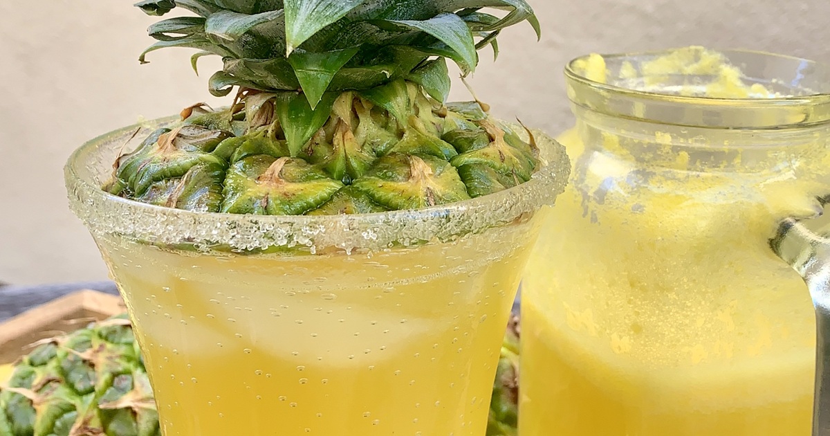National Margarita Day Recipes Close Up of a Pineapple Margarita Garnished with a Top of a Pineapple