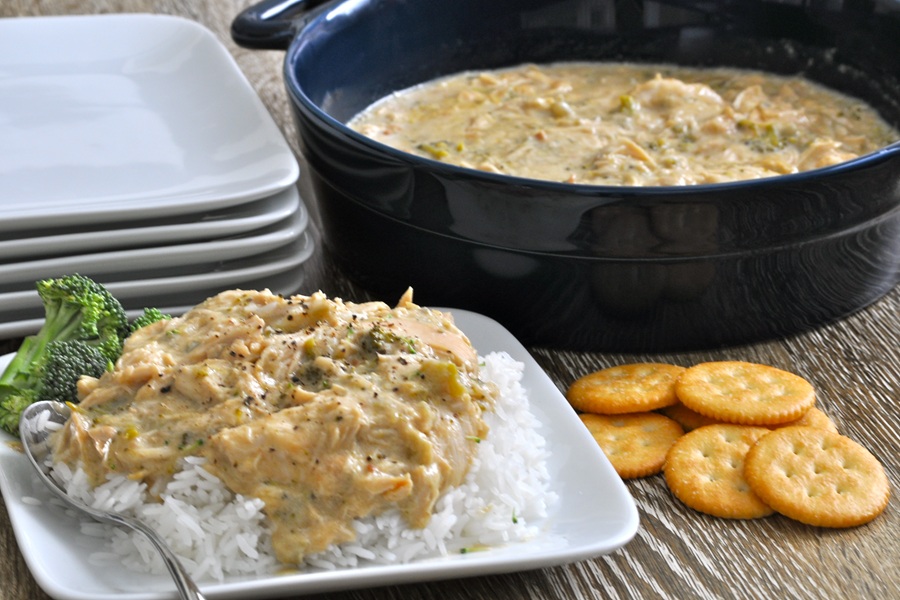 Easter Appetizers a Plate of White Rice Topped with Shredded Chicken and Crackers Next to a Crockpot Filled with Chicken and Cracker Casserole
