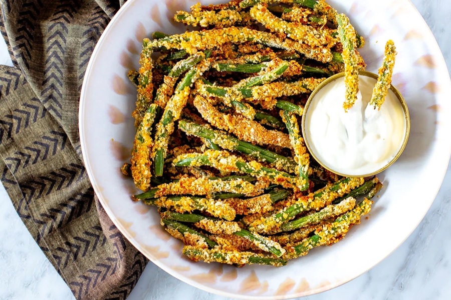 Healthy Easter Dinner Side Dishes Crispy Green Bean Fries in a Bowl with a Small Ramekin of Ranch Dressing