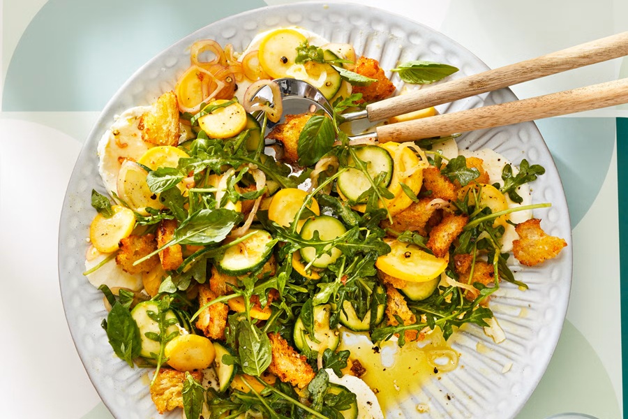Healthy Easter Dinner Side Dishes Summer Squash Panzanella on a Plate with Serving Tongs