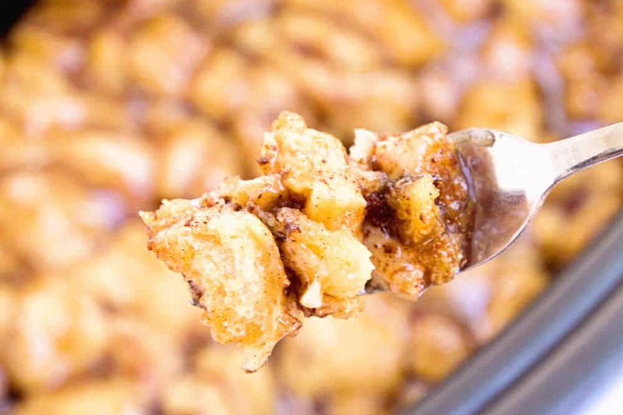 Crockpot Mother's Day Brunch Recipes Close Up of Crock Pot Caramel Apple Rolls Recipe on a Fork