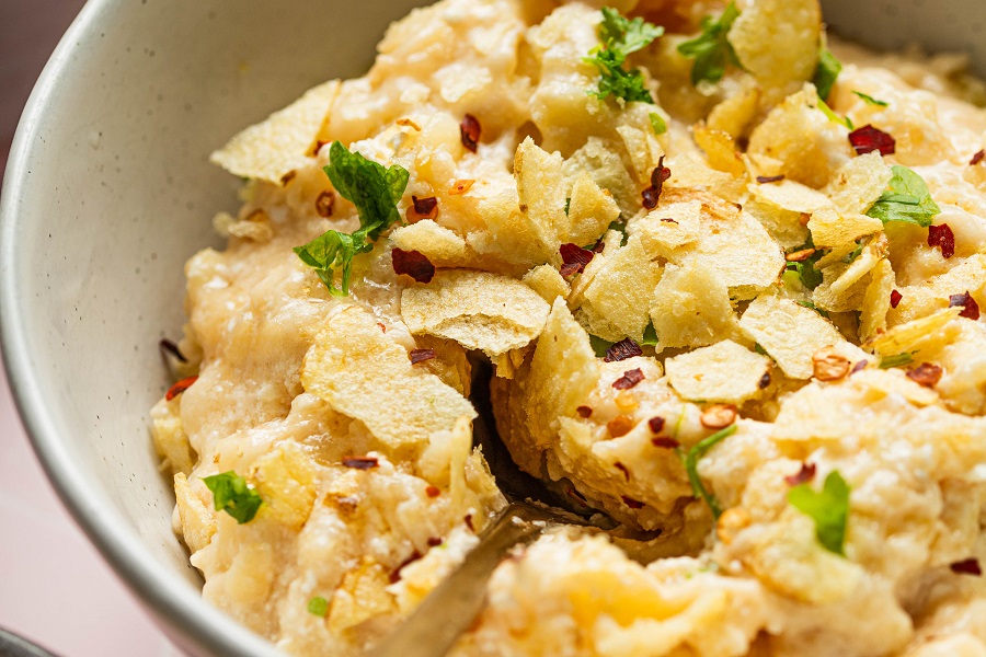 Crockpot Mother's Day Brunch Recipes Close Up of Crockpot Cheesy Hash Browns Topped with Potato Chips