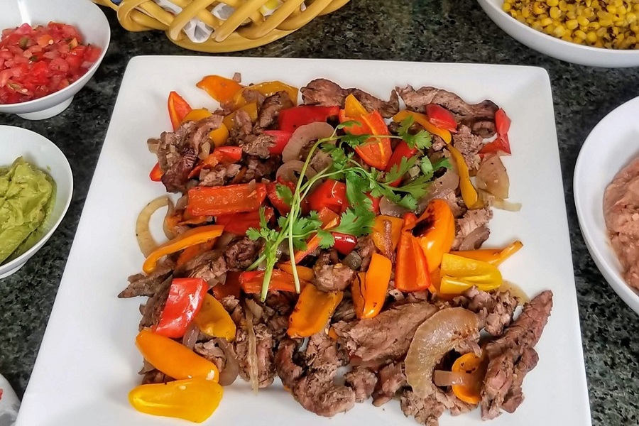 Dinner Ideas for Mother's Day a Square White Plate Filled with Steak Fajitas