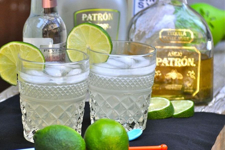 Best Boating Drinks Patr&oacute;n Skinny Margarita with Limes and Ingredients in the Background
