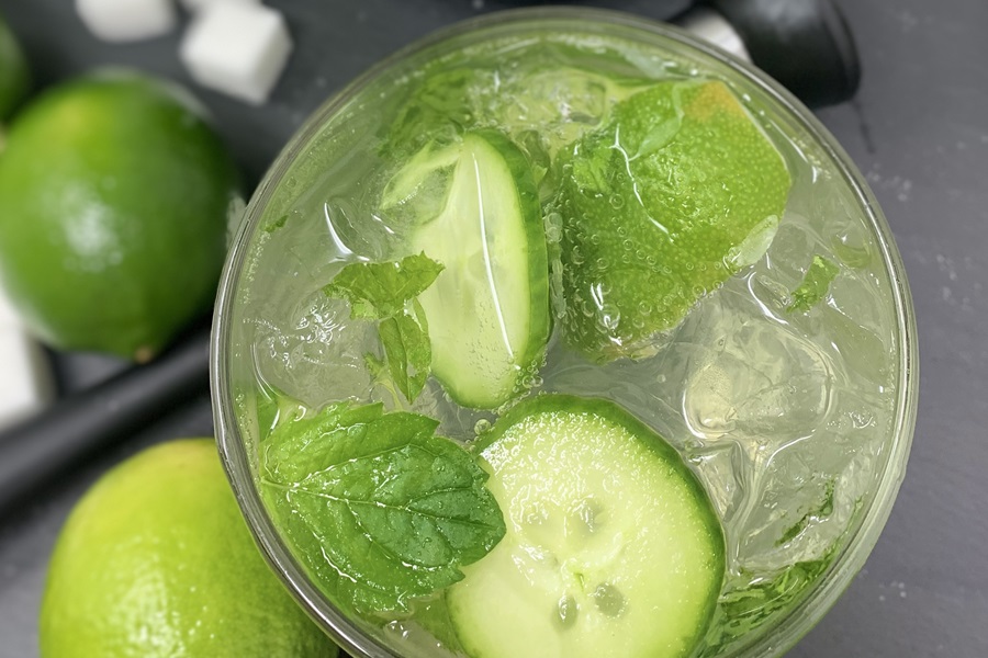 Best Boating Drinks Sparkling Cucumber Cooler with Gin Cocktail Recipe Garnished with Cucumber Slices