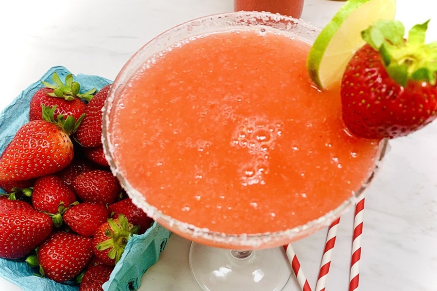 Best Boating Drinks Strawberry Margarita Next to a Small Basket of Strawberries